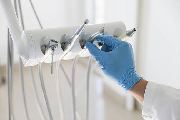 Professional Tooth Extraction technician working in East Moriches, NY